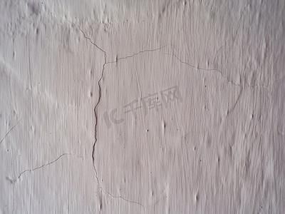 有裂缝的旧粉刷墙的背景。