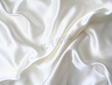 作为背景的光滑的典雅的白色丝绸