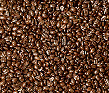 咖啡豆纹理摄影照片_平坦背景中的烤咖啡豆