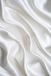 布匹丝绸摄影照片_作为背景的光滑的典雅的白色丝绸