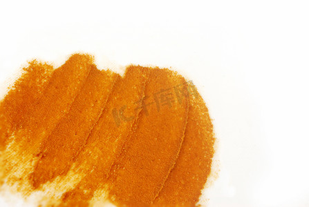 磨砂摄影照片_用姜黄标记磨砂膏。