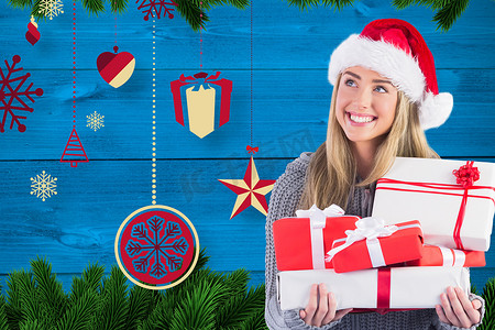 戴着圣诞帽的漂亮女人在数字生成的背景下拿着礼物
