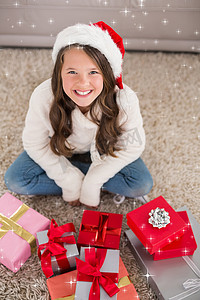 节日小女孩带着礼物对着相机微笑的合成图像