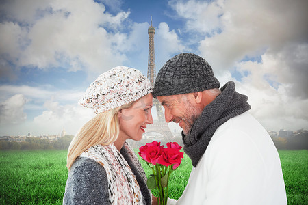 微笑情侣在冬季时尚与玫瑰合影的合成图像
