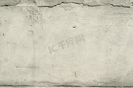 纹理旧混凝土墙与石膏残留与裂缝