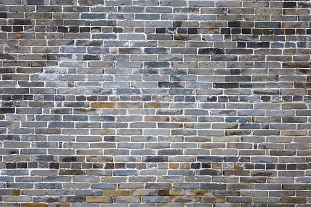 砖条墙石砖墙摄影照片_古老的灰色砖墙