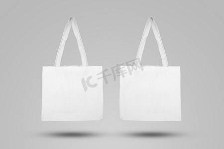 婚礼logo样机摄影照片_用于购物的样机白色手提袋面料，样机帆布袋纺织品与可重复使用。