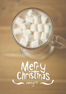 房屋合成摄影照片_圣诞快乐消息与一杯热巧克力的数字合成图像