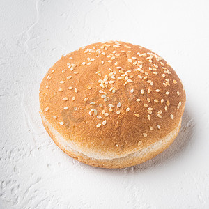 快地摄影照片_白石背景中带芝麻、方形的新鲜自制汉堡包