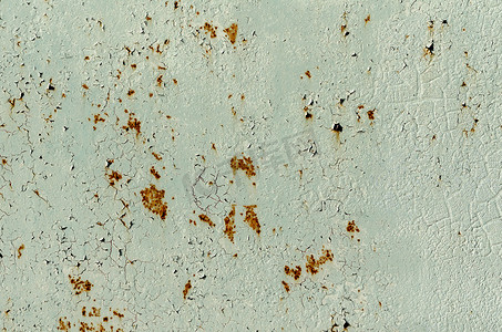旧生锈铁墙的背景纹理图案与绿色排