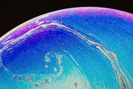 梯度流体摄影照片_由彩色肥皂泡膜制成的流体艺术。