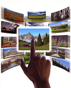 多媒体图片摄影照片_触摸屏上的手和图片拼贴