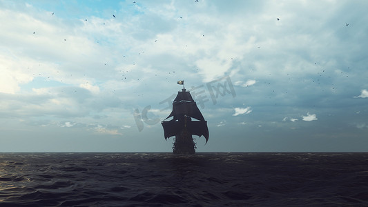 旧旗摄影照片_一艘飘扬着海盗旗的旧海盗船在雾蒙蒙的清晨掠过大海。 