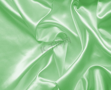 作为背景的光滑的典雅的绿色丝绸或缎子纹理