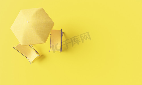 黄色背景中的黄色椅子和雨伞