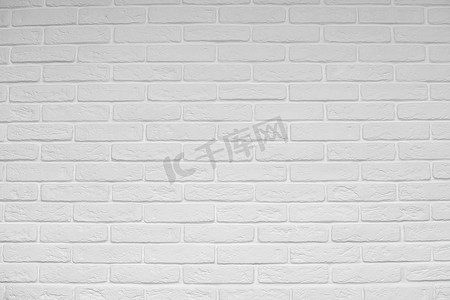 白色砖墙摄影照片_白色砖墙抽象背景或纹理，新的和干净的。