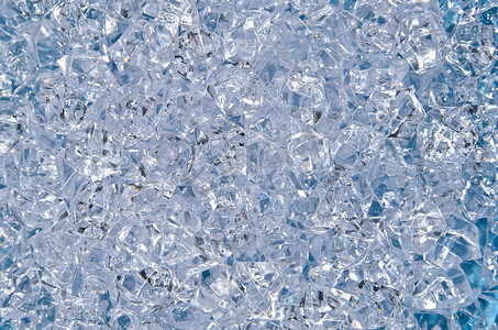 冰钻摄影照片_蓝色玻璃水钻的抽象背景
