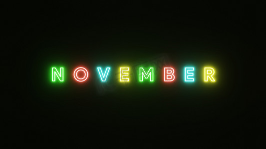 庆祝霓虹灯摄影照片_11 月文本霓虹灯在黑色背景上五颜六色。 