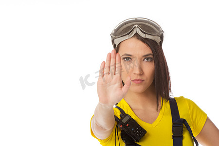 手势信号摄影照片_拿着停车信号的女性建筑工人-被隔绝。