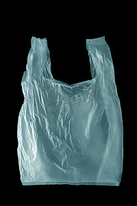 产品背景大气摄影照片_黑色背景中皱巴巴的一次性塑料袋