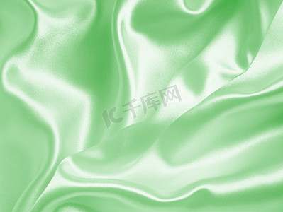 背景窗帘摄影照片_作为背景的光滑的典雅的绿色丝绸或缎子纹理
