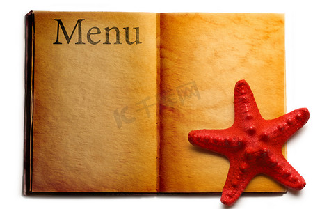 书羊皮纸摄影照片_打开菜单书和红海星