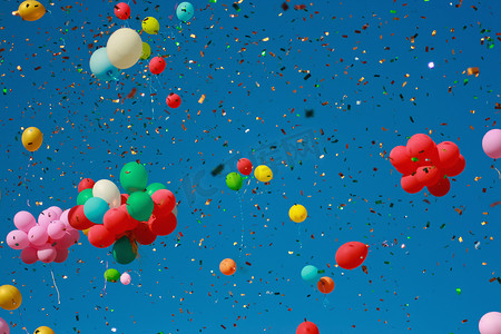 闪光气球摄影照片_五彩缤纷的闪光气球飞向蓝天。