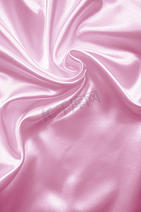 光滑优雅的粉色丝绸或缎子作为婚礼背景