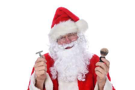 拿着剃刀和剃须刷的圣诞老人特写镜头，考虑剪掉他的胡子。