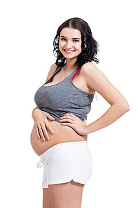 孕期摄影照片_愉快的美丽的年轻孕妇