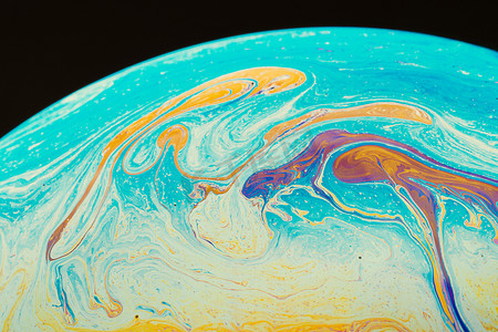 梯度流体摄影照片_由彩色肥皂泡膜制成的流体艺术。