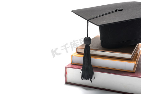 论文毕业摄影照片_毕业帽和书