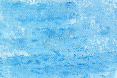 纸张纹理上蓝色水彩的抽象背景