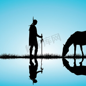 美洲印第安人剪影与马在湖岸上反射在水中