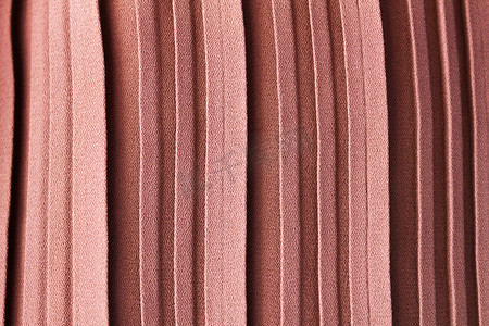 褶皱的布料摄影照片_褶皱或褶皱的粉红色柔和色彩抽象纹理背景