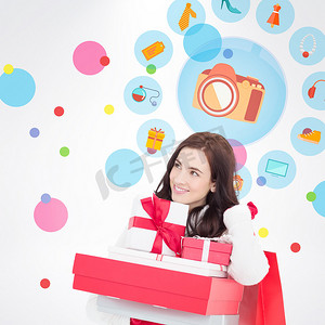 快乐的黑发女郎拿着圣诞礼物和购物袋的合成图像