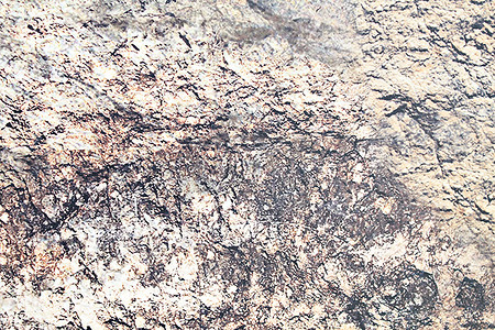 黑色砂石摄影照片_抽象砂石纹理的细节