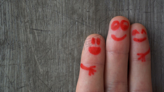 Happy fingers.beautiful faces painted on the toes