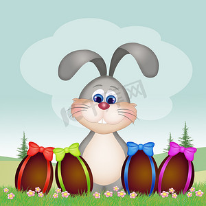 可爱兔耳朵与兔摄影照片_复活节兔子与巧克力蛋
