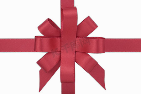 圣诞红摄影照片_“红丝带系成蝴蝶结，孤立在白色背景上，”