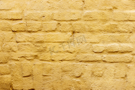 在黄色绘的砖墙