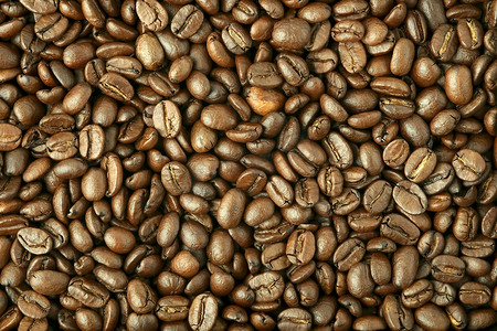 咖啡咖啡豆面包摄影照片_背景由咖啡豆制成