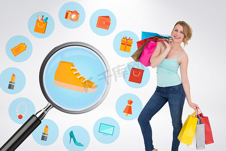 站着的人图标摄影照片_微笑的金发女人拿着购物袋站着的合成图像