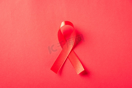 蝴蝶结丝带摄影照片_红色蝴蝶结丝带标志 HIV、艾滋病癌症意识