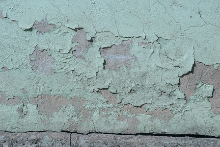 有剥落的老膏药的混凝土墙，剥落的油漆，海蓝宝石颜色纹理，背景