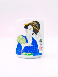 蒙杯子摄影照片_白色背景中突显的亚洲陶瓷茶杯