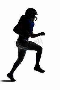 剪影美式足球运动员奔跑