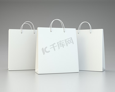 包装广告设计摄影照片_用于广告和品牌推广的灰色空购物袋。 