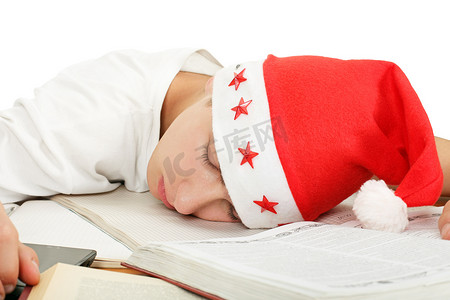 圣诞节考试摄影照片_学生戴着圣诞帽睡觉