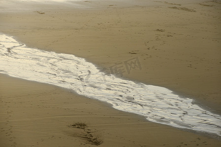 水纹的图案摄影照片_沙滩上的水纹